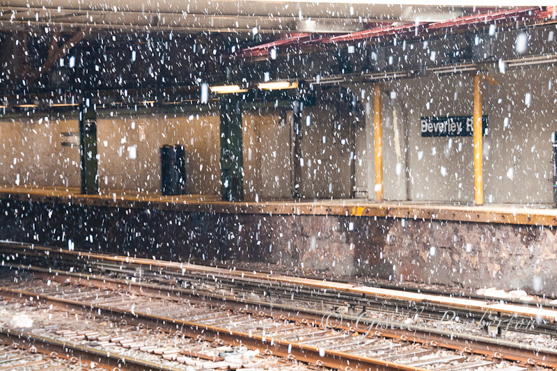 Snow falling on the tracks of the train station
